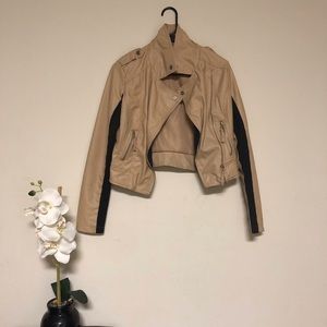 Beige and black leather jacket
